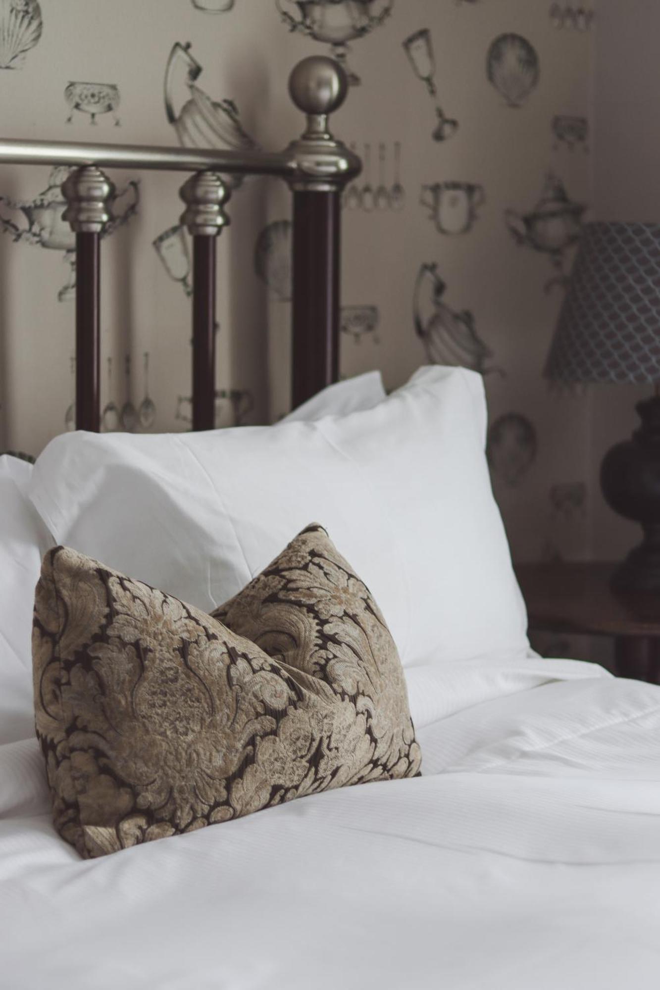 Longlands Inn & Cottages Carnforth Exterior photo A bed with pillows