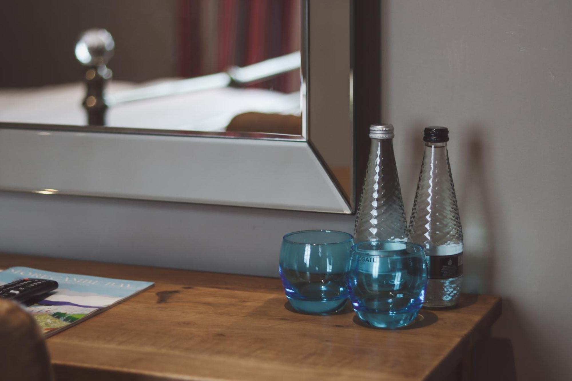 Longlands Inn & Cottages Carnforth Exterior photo Bottled water in a hotel room